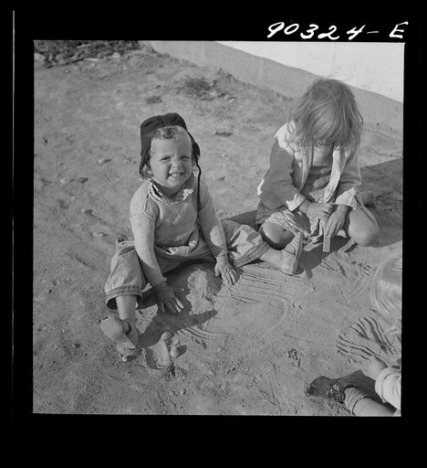 Children of defense workers playing outside of their homes in Sunset Village. FSA (Farm Security Administration) housing project. Radford, Virginia