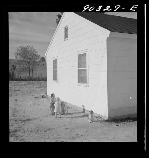 Children of defense workers playing outside their home in Sunset Village, FSA (Farm Security Administration) housing project. Radford, Virginia