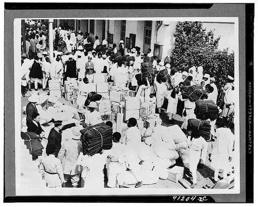 Addis Ababa, Ethiopia. Medical supplies for the front, including bales of cotton, wool, and warm blankets, are being piled up at the railway station