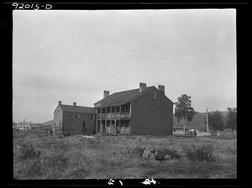 Eleanor, West Virginia. Rear view of administration building at Red House after which Red House Farms was named. The "Red House" was built of brick prior to 1825 by Joseph Ruffuer