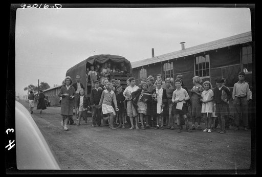 Eleanor, West Virginia. Two hundred forty-four children attend the grade school of the Red House farms project barracks, supervised by eight teachers furnished by the county. Grade children are transported in the project trucks