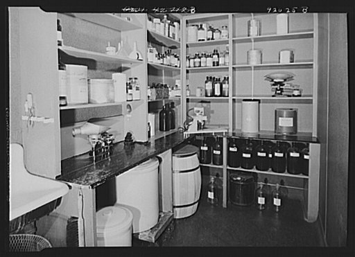 U.S. FSA (Farm Security Administration), later U.S. Office of War Information, photograph laboratory in the Auditor's Building. Washington, D.C. Chemical mixing room, showing supplies, scales, etc.