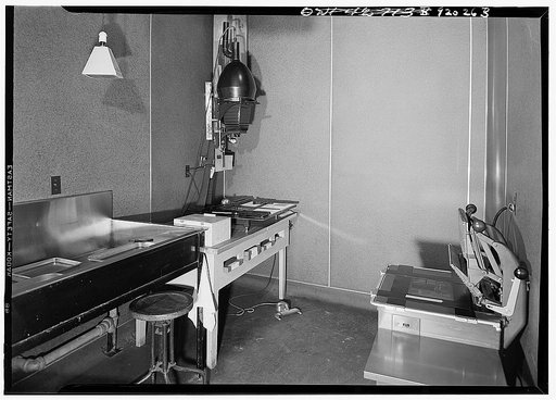 U.S. FSA (Farm Security Administration)--later U.S. OWI (Office of War Information) photograph laboratory in the auditor's building, Washington, D.C. Enlarging and contact room, showing, an Eastman auto-focus enlarger (5x7) on the left and an 8 x 10 professional ocontact printer on the right
