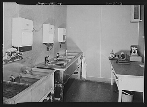 U.S. FSA (Farm Security Administration), later U.S. Office of War Information, photograph laboratory in the Auditor's Building. Washington, D.C. Film developing room