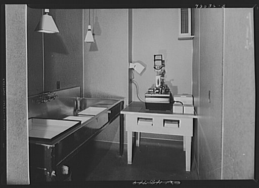 U.S. FSA (Farm Security Administration), later U.S. Office of War Information, photograph laboratory in the Auditor's Building. Washington, D.C. Emby 35mm printer for contact prints and enlargements