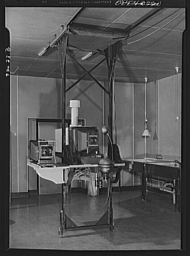 U.S. FSA (Farm Security Administration), later U.S. Office of War Information, photograph laboratory, in the Auditor's Building. Washington, D.C. Combination stand for copying camera, horizontal mural enlarger, and Leitz 35mm enlarger for extreme vertical projection. Photo murals as large as twenty-