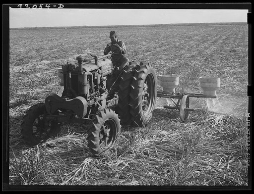 Untitled photo, possibly related to: Fertilizer for large fields of sugarcane distributed by tractor-driven fertilizer machine. USSC (United States Sugar Corporation). Clewiston, Florida