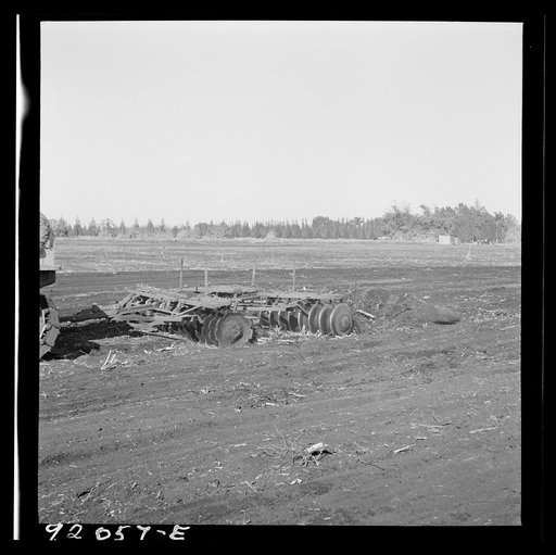 Untitled photo, possibly related to: Sugarcane fields. Tractor-driven disc plough and harrow is used on many large flat muck land farms. This farm is about 2000 acres. Near Lake Okeechobee and Clewiston, Florida