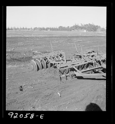 Untitled photo, possibly related to: Sugarcane fields. Tractor-driven disc plough and harrow is used on many large flat muck land farms. This farm is about 2000 acres. Near Lake Okeechobee and Clewiston, Florida