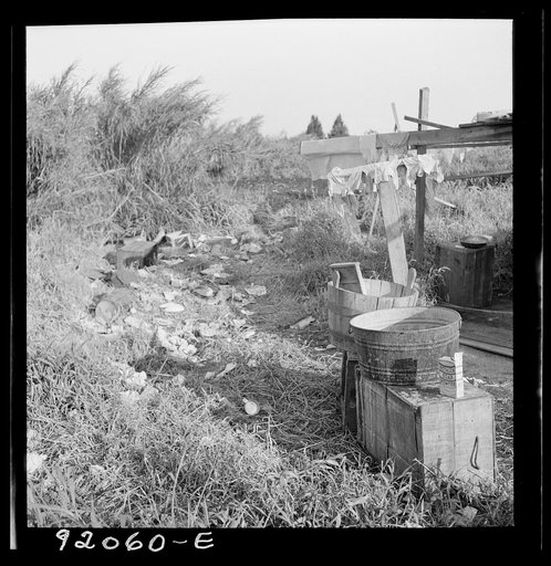 Untitled photo, possibly related to: Migrant laborers camped beside a packinghouse in Belle Glade, Florida