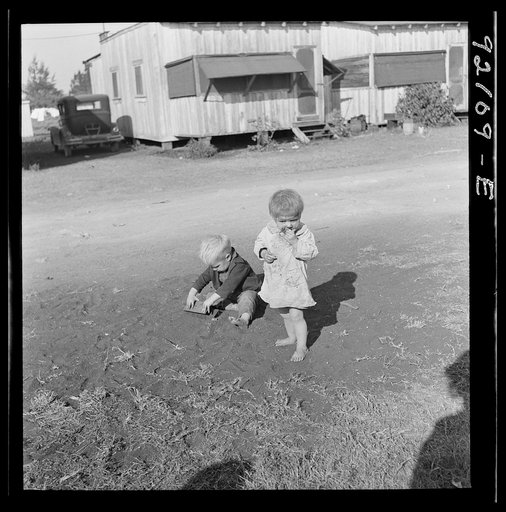 Untitled photo, possibly related to: Migrant laborers children living in overcrowded camps with very bad sanitary conditions. Belle Glade, Florida