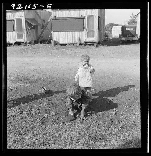 Untitled photo, possibly related to: Migrant laborers children living in overcrowded camps with very bad sanitary conditions. Belle Glade, Florida