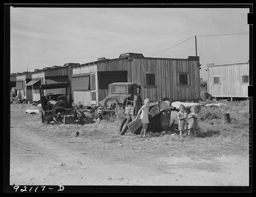 Untitled photo, possibly related to: A few crowded, dirty, expensive camps, with bad sanitary conditions, no light, insufficient and poor water supply, exist near Belle Glade, Florida, for transient migrant labor. One toilet for 150 people