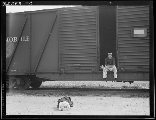 Untitled photo, possibly related to: Car on siding across tracks from pea packing plant. Twenty-five year old itinerant, originally from Oregon. "On the road eight years, all over the country, every state in the union, back and forth, pick up a job here and there, travelling all the time." Calipatri