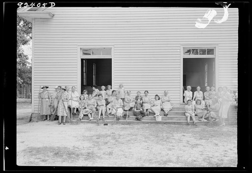 Untitled photo, possibly related to: Women of the congregation of Wheeley's Church on steps with brooms and buckets on annual clean up day. Gordonton, North Carolina