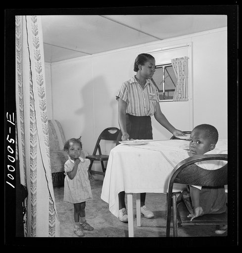 Arlington, Virginia. FSA (Farm Security Administration) trailer camp project for Negroes. Interior of an expansible trailer, showing one wing used as a dining and living room