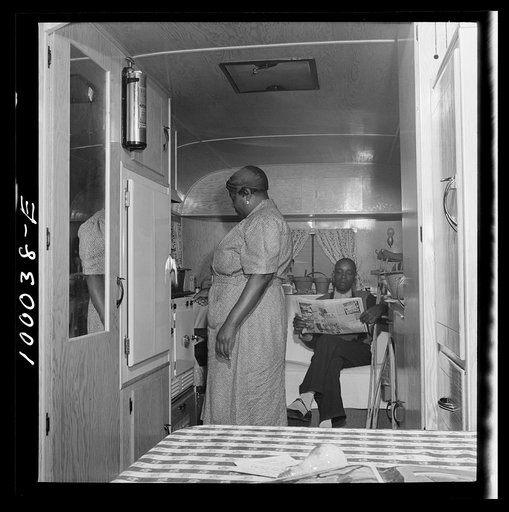 Arlington, Virginia. FSA (Farm Security Administration) trailer camp project for Negroes. Interior of a single type trailer showing cooking facilities and couch which can be converted into a bed