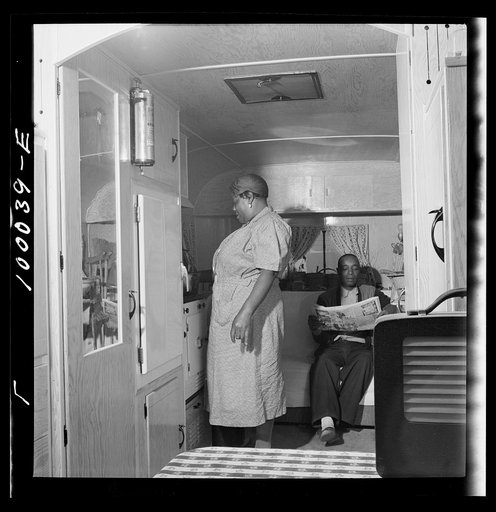 Untitled photo, possibly related to: Arlington, Virginia. FSA (Farm Security Administration) trailer camp project for Negroes. Interior of a single type trailer showing cooking facilities and couch which can be converted into a bed