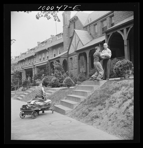 Untitled photo, possibly related to: Washington, D.C. Salvage drive, Victory Program. Schoolboy volunteers to go from house to home collecting scrap paper