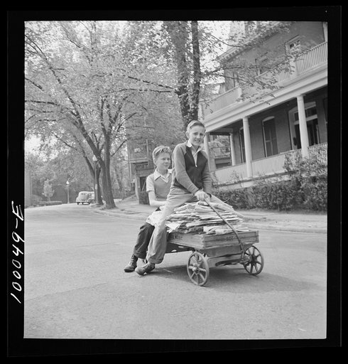 Untitled photo, possibly related to: Washington, D.C. Salvage drive, Victory Program. Schoolboy volunteers to go from house to home collecting scrap paper