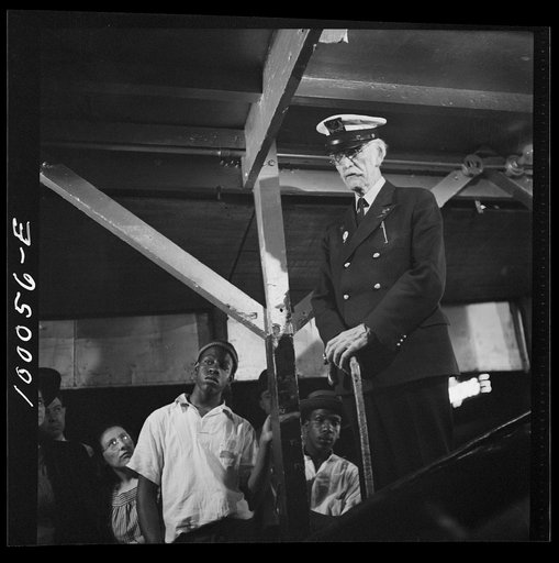 Norfolk, Virginia. Impresario in a travelling railroad show, who pretends to be a sea captain who captured the whale on exhibit in the show