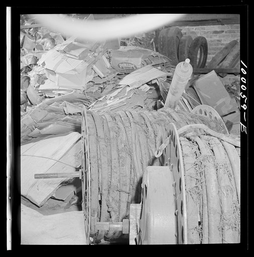 Washington, D.C. Salvage drive, Victory Program. Rubber hose and scrap paper stored in District wholesale junk company warehouse
