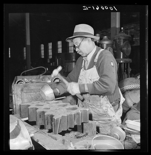 Washington, D.C. Salvage drive, Victory Program. "Cleaning" metal by hammering off parts to separate kinds of metal