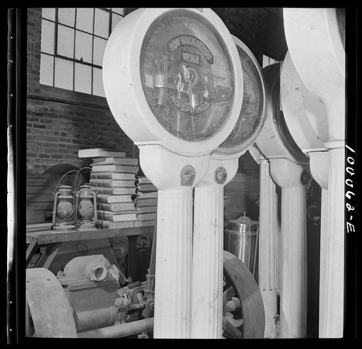 Washington, D.C. Salvage drive, Victory Program. Restaurant scales among objects stored in warehouse of District wholesale junk company
