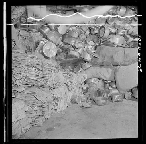 Washington, D.C. Salvage drive, Victory Program. Aluminum kitchen utensils and scrap paper stored in warehouse of District wholesale junk company