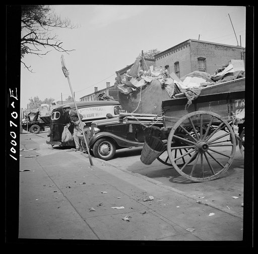 Washington, D.C. Salvage drive, Victory Program. Variety of junk-bearing vehicles parked outside. District retail junk company