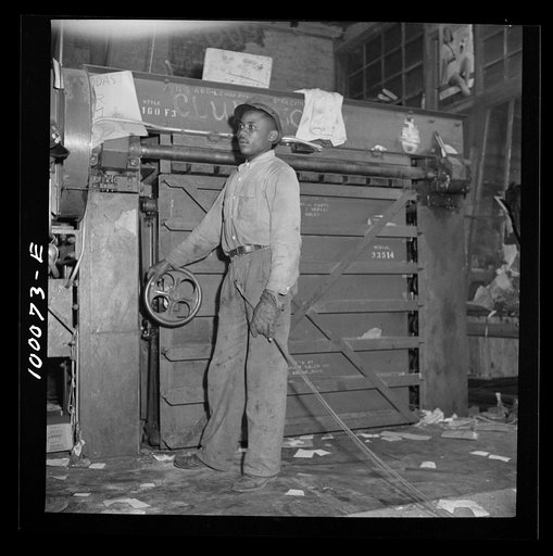 Washington, D.C. Salvage drive, Victory Program. Hydraulic press for scrap paper in retail junk company