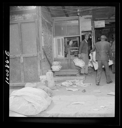 Untitled photo, possibly related to: Washington, D.C. Scrap salvage campaign, Victory Program. Scrap being weighed before their purchase by retail junk dealer