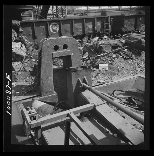 Washington, D.C. Scrap salvage campaign, Victory Program. Powerful hydraulic press for pressing metal scrap into blocks in the yard of a wholesale junk company
