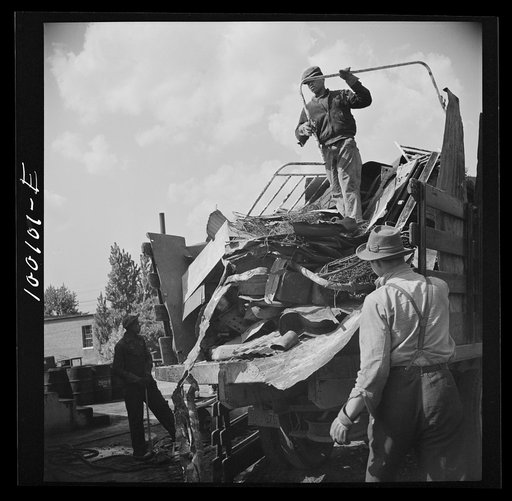Untitled photo, possibly related to: Washington, D.C. Scrap salvage campaign, Victory Program. Unloading scrap at a wholesale junkyard
