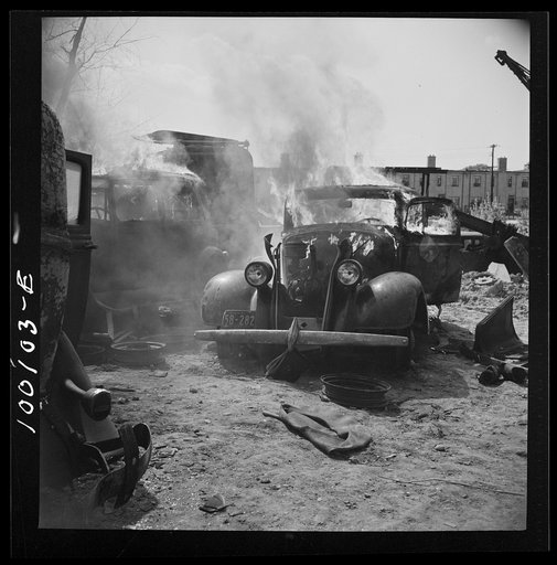Washington, D.C. Scrap salvage campaign, Victory Program. After saleable parts are removed from old cars, the cars are burned in order to strip them of useless materials and to obtain metal skeleton for scrap