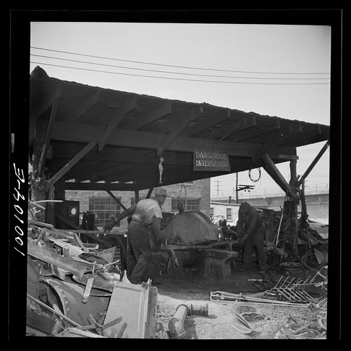 Untitled photo, possibly related to: Washington, D.C. Scrap salvage campaign, Victory Program. Large cutter which breaks up metal parts for shipment from a wholesale junkyard