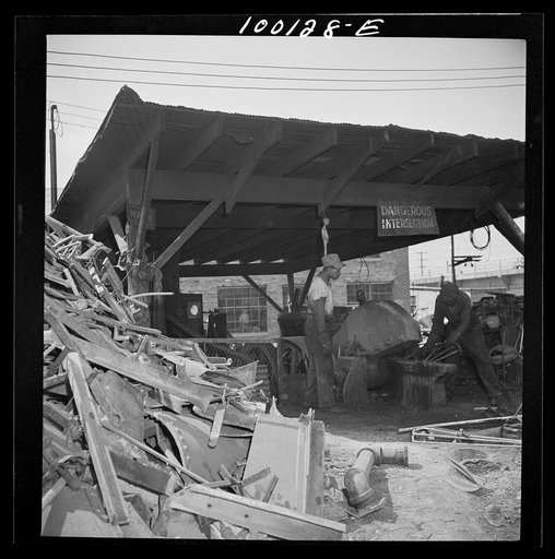 Untitled photo, possibly related to: Washington, D.C. Scrap salvage campaign, Victory Program. Large cutter which breaks up metal parts for shipment from a wholesale junkyard