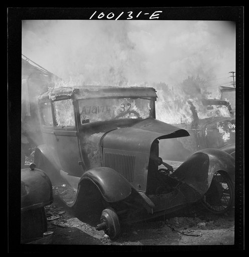 Washington, D.C. Scrap salvage campaign, Victory Program. After saleable parts are removed from old cars, the cars are burned in order to strip them of useless materials and to obtain metal skeleton for scrap