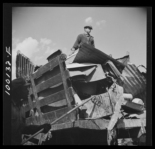 Washington, D.C. Scrap salvage campaign, Victory Program. Unloading metal scrap from a truck at a wholesale junkyard