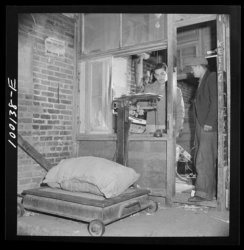 Washington, D.C. Scrap salvage campaign, Victory Program. Weighing scrap brought to sell to a retail junk dealer