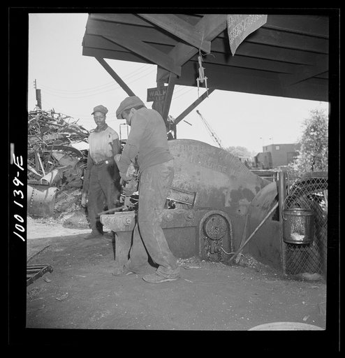 Untitled photo, possibly related to: Washington, D.C. Scrap salvage campaign, Victory Program. Large cutter which breaks up metal parts for shipment from a wholesale junkyard