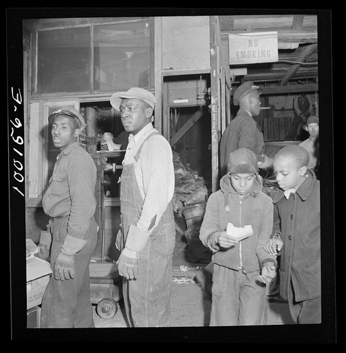 Untitled photo, possibly related to: Washington, D.C. Scrap salvage campaign, Victory Program. Scrap being weighed before their purchase by retail junk dealer