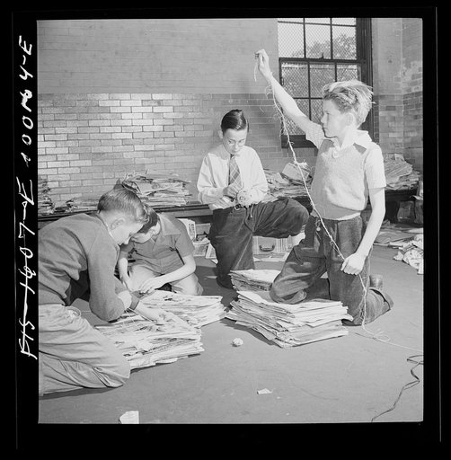 Washington, D.C. Scrap salvage campaign, Victory Program. Tying up bundles of scrap paper at public school. A company truck collects once a week from each school in a truck