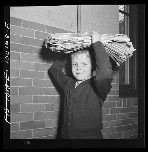 Washington, D.C. Scrap salvage campaign, Victory Program. Washington schoolchild brings a load of scrap paper to school once a week. Here it is collected by paper company truck