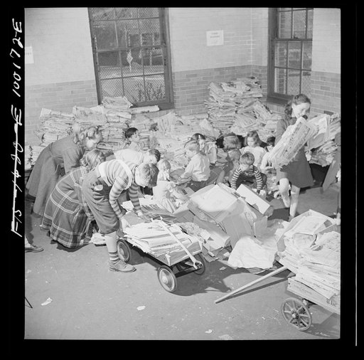 Washington, D.C. Scrap salvage campaign, Victory Program. Schoolchildren bring their scrap paper from their classrooms into the cellar, where it is picked up by paper company truck