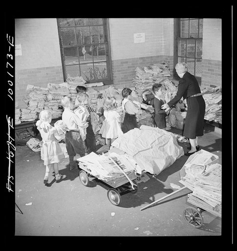 Washington, D.C. Scrap salvage campaign, Victory Program. Schoolchildren bring their scrap paper from their classrooms into the cellar, where it is picked up by paper company truck