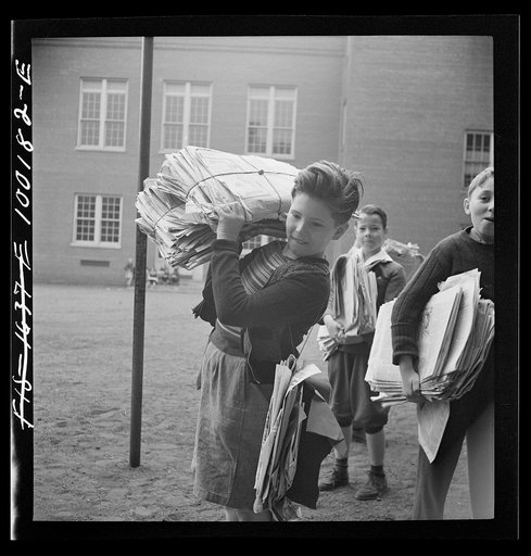 Untitled photo, possibly related to: Washington, D.C. Scrap salvage campaign, Victory Program. Children bringing their weekly contribution of scrap paper to school