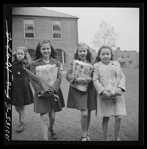 Untitled photo, possibly related to: Washington, D.C. Scrap salvage campaign, Victory Program. Children bringing their weekly contribution of scrap paper to school