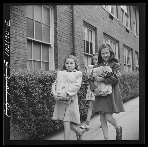 Untitled photo, possibly related to: Washington, D.C. Scrap salvage campaign, Victory Program. Children bringing their weekly contribution of scrap paper to school