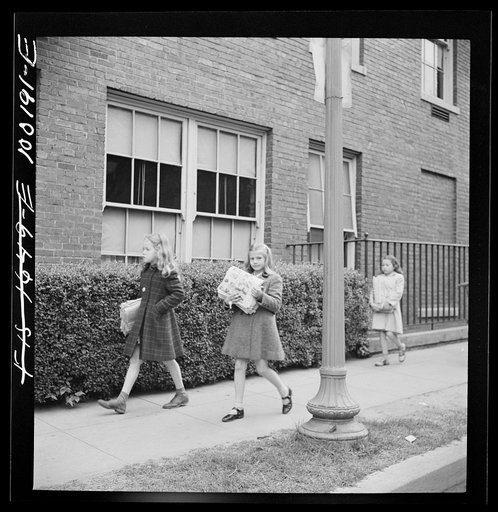 Untitled photo, possibly related to: Washington, D.C. Scrap salvage campaign, Victory Program. Children bringing their weekly contribution of scrap paper to school